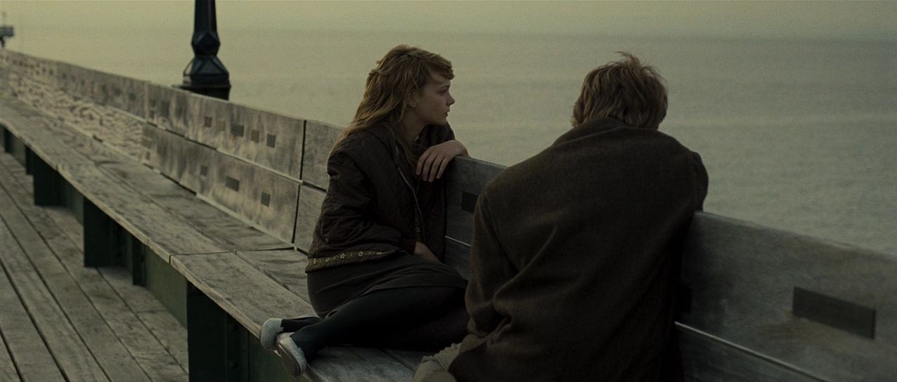 A screenshot of Kathy and Tommy from the 2010 movie adaptation of Kazuo Ishiguro's 'Never Let Me Go'