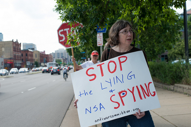a woman protesting government surveillance